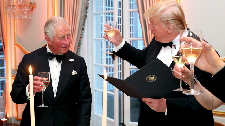 Donald Trump and King Charles III making a toast