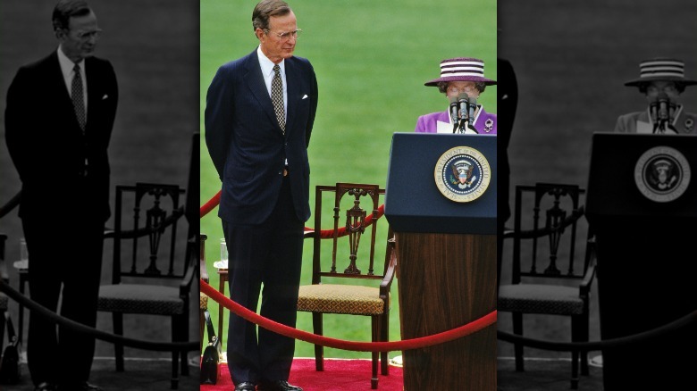 President George Bush looking at Queen Elizabeth II