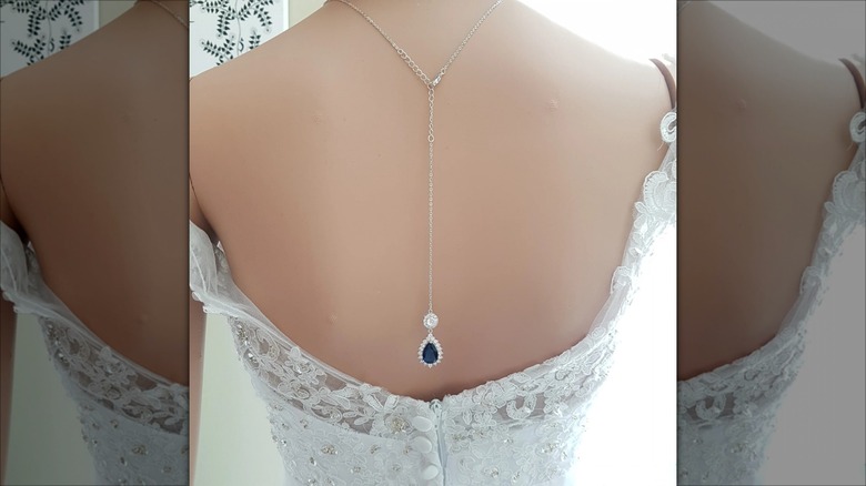 mannequin with sapphire backdrop necklace
