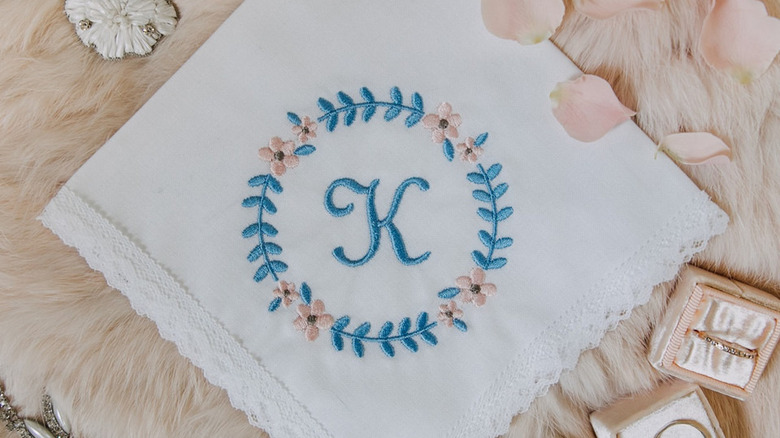 handkerchief with blue embroidered letter
