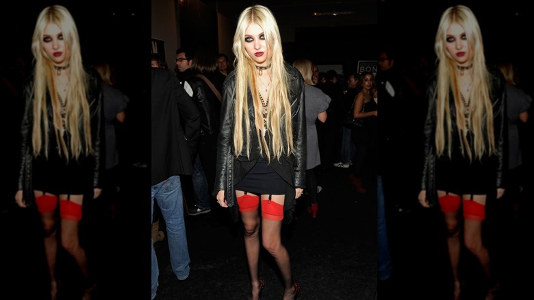 Taylor Momsen posing in crowd with long hair extensions in 2010