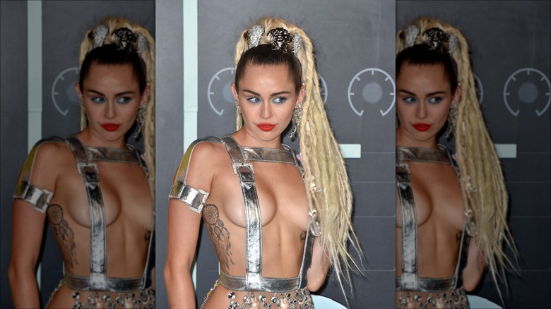 Miley Cyrus VMAs red carpet silver strap dress dreadlocks