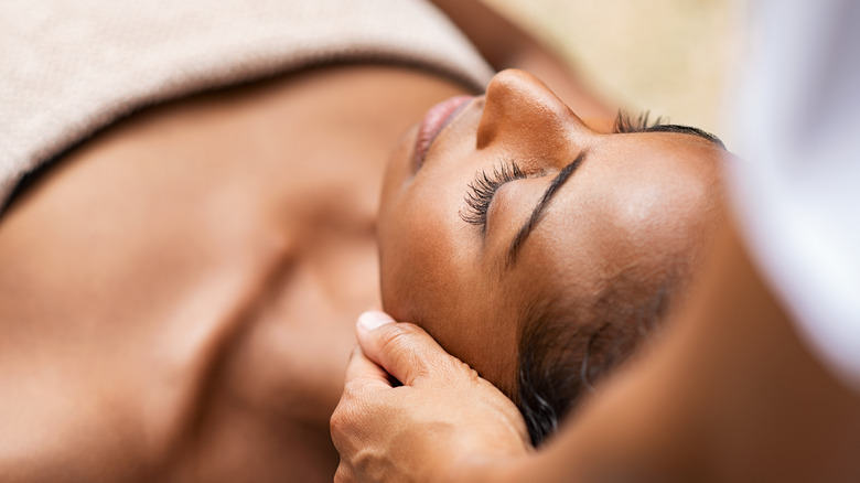 woman getting her head massaged