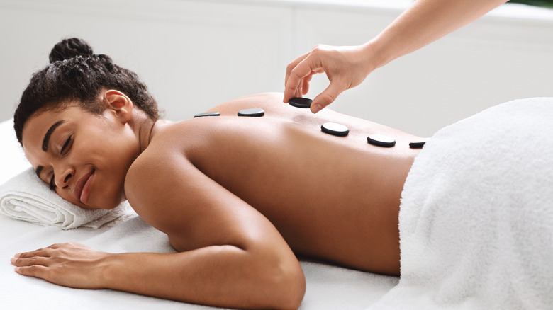 woman getting a hot stone massage