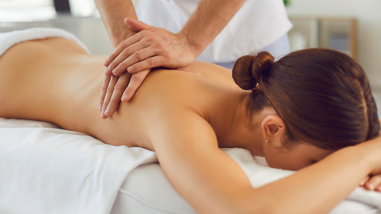 woman getting her back massaged