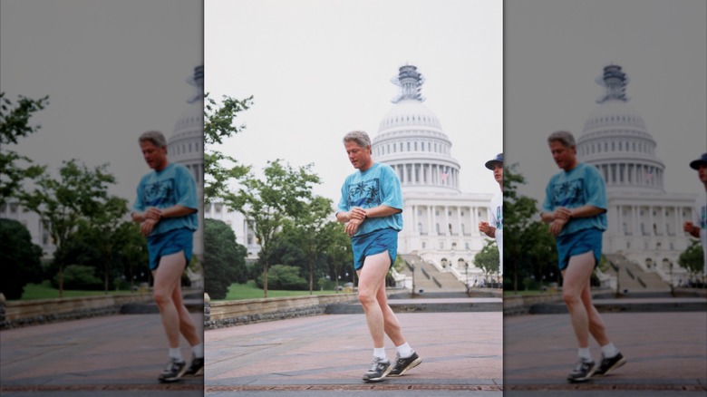 Bill Clinton walks in blue shorts