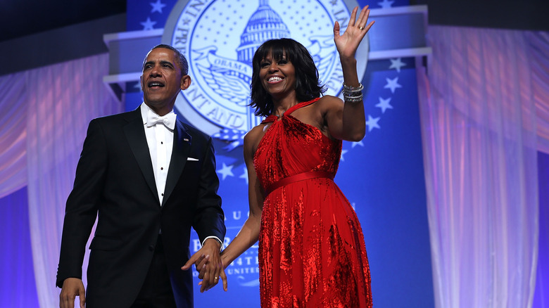 Barack Obama holding hands with wife Michelle Obama