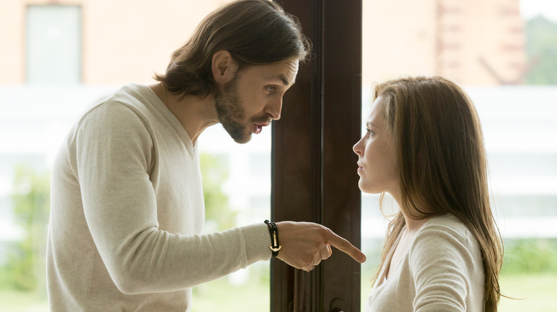 man yelling at woman