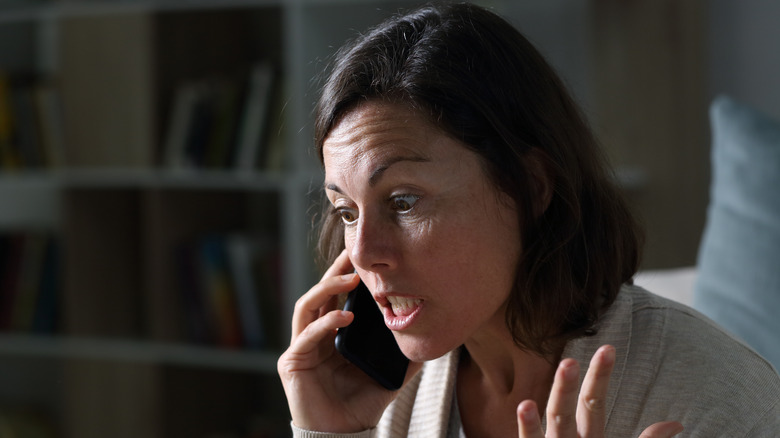 frustrated woman talking phone