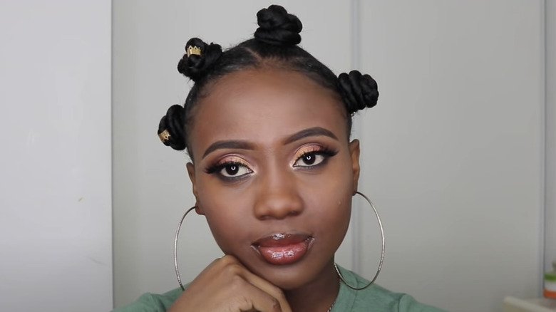 Black woman with Bantu knots