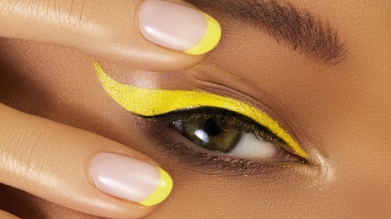 woman with yellow neon make-up