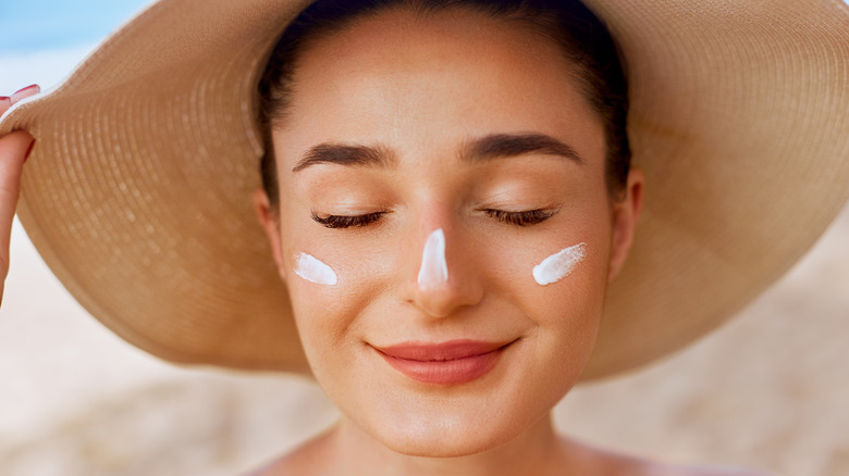 Woman with sunscreen on face