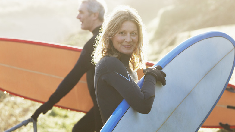 Man and woman surfing