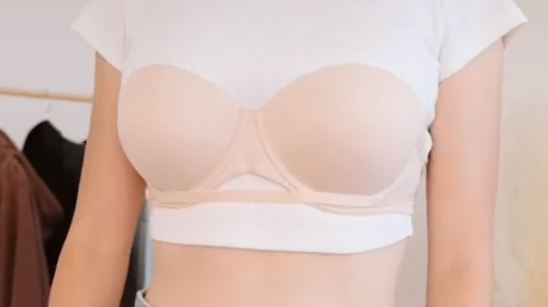 Strapless bra over white t-shirt