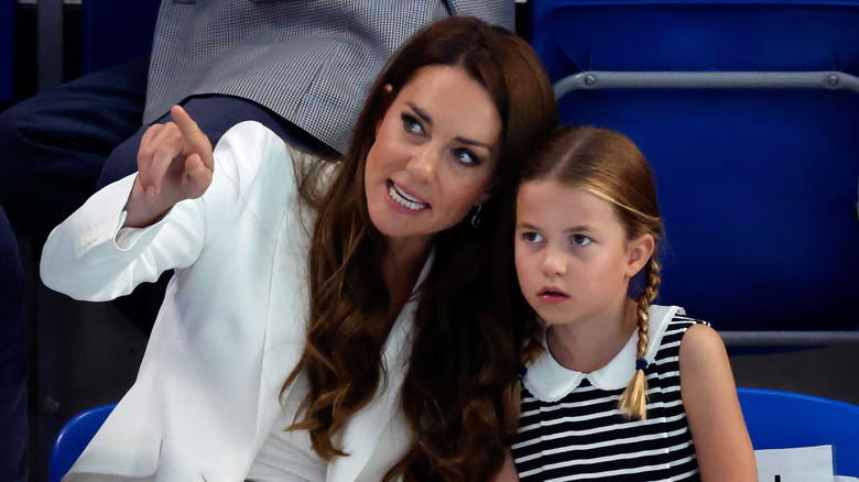 Princess Catherine talking to Princess Charlotte