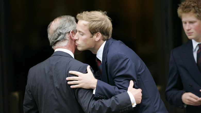 Charles and William embrace 