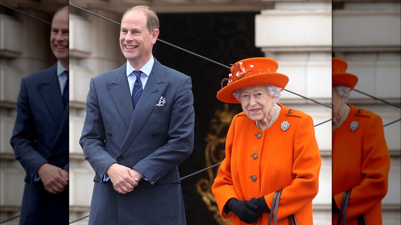 Prince Edward and Queen Elizabeth smiling at an event