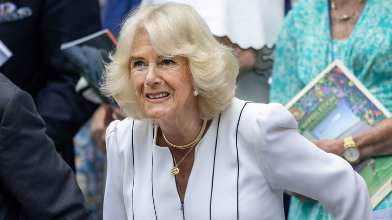 Queen Camilla smiling in crowd 