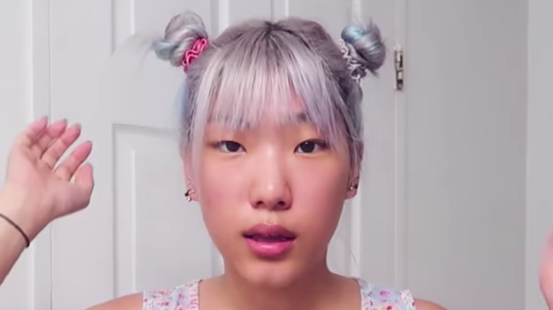 woman wearing space buns