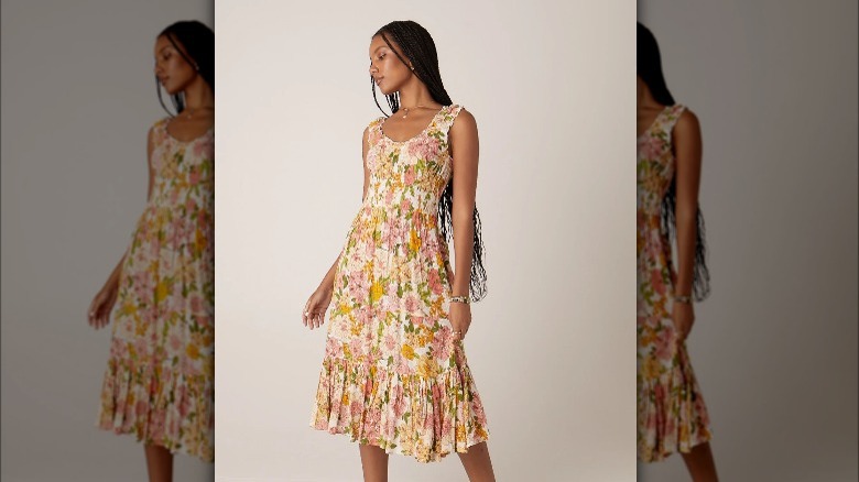 Model wearing flower print dress