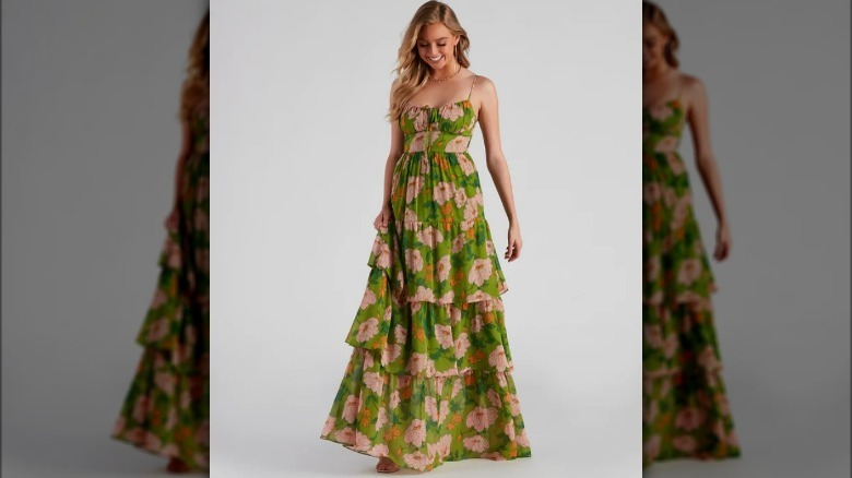 Model wearing green tiered flower dress