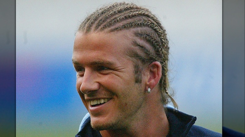 David Beckham smiling with cornrows in 2003