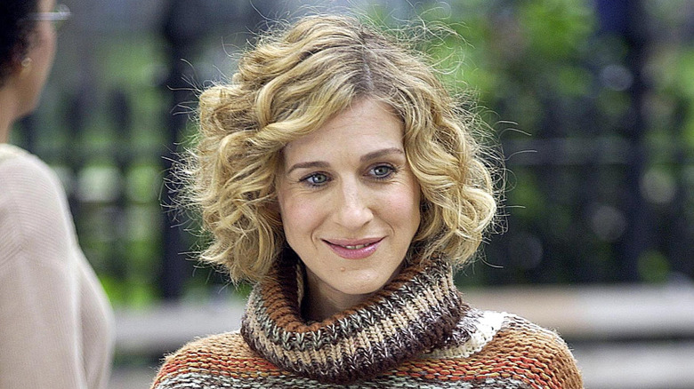 Sarah Jessica Parker smiling on Sex and the City with short hair