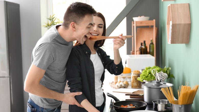 A couple cooking together