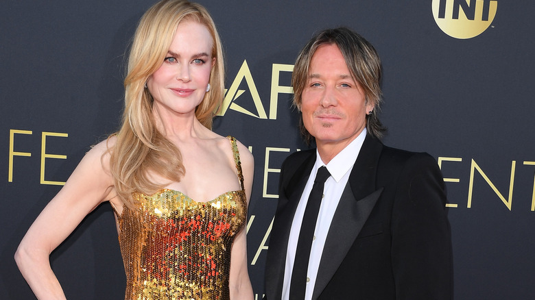 Nicole Kidman and Keith Urban posing on step-and-repeat