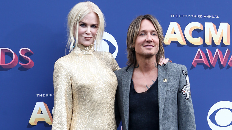 Nicole Kidman and Keith Urban posing on step-and-repeat