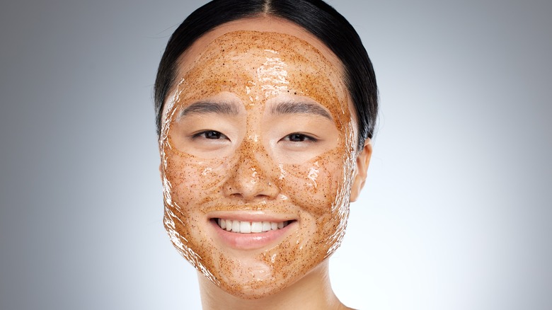 woman exfoliating mask