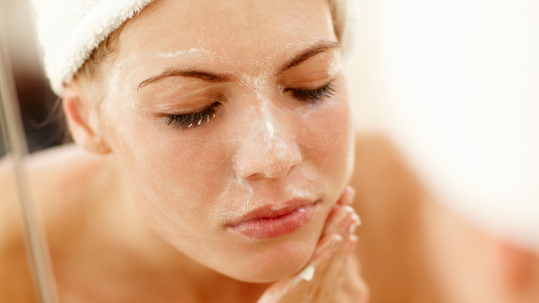 woman washing face