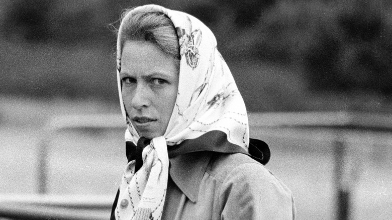 Young Princess Anne looking at camera in head scarf