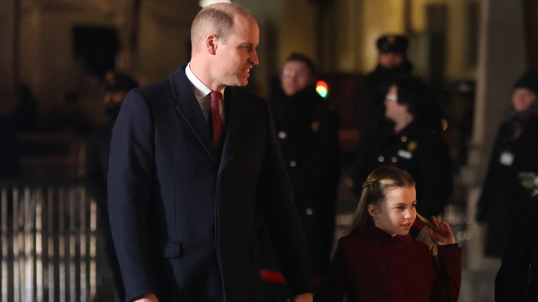 Princess Charlotte holding her dad's hand