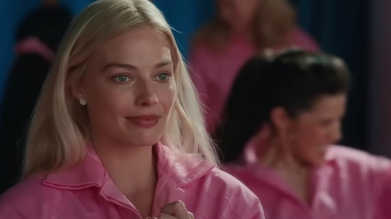 Margot Robbie in a pink jumpsuit in Barbie