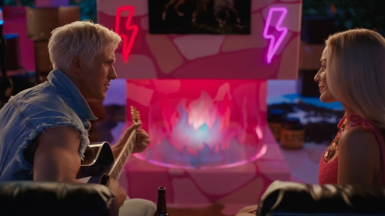 Ken plays the guitar to Barbie