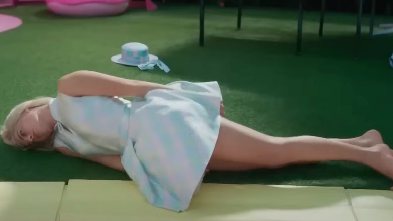 Margot Robbie lying on the ground in "Barbie"