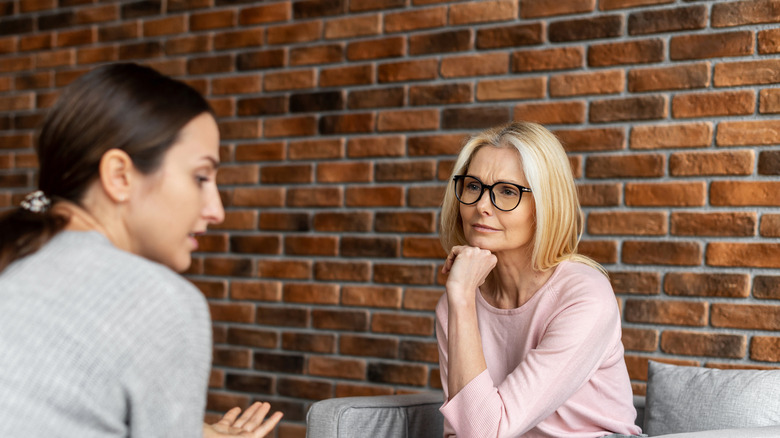 Woman listening to woman talking