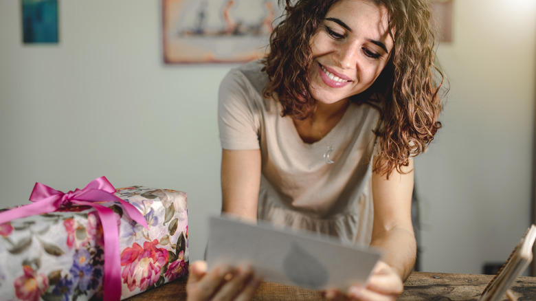 Woman reading gift card