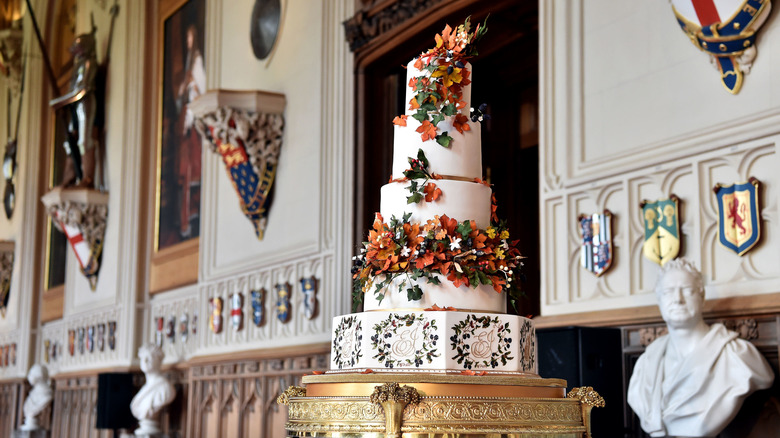 Royal wedding cake with colorful flowers 