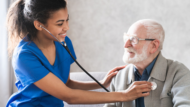 Doctor listening to a patient's heartbeat