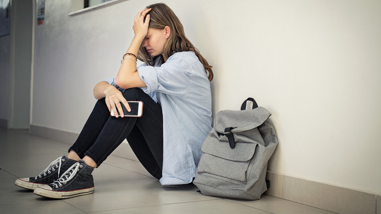 Woman sitting on floor