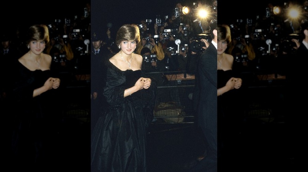 Princess Diana wearing black in front of the press