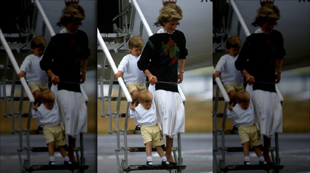 Princess Diana exiting a plane with her sons