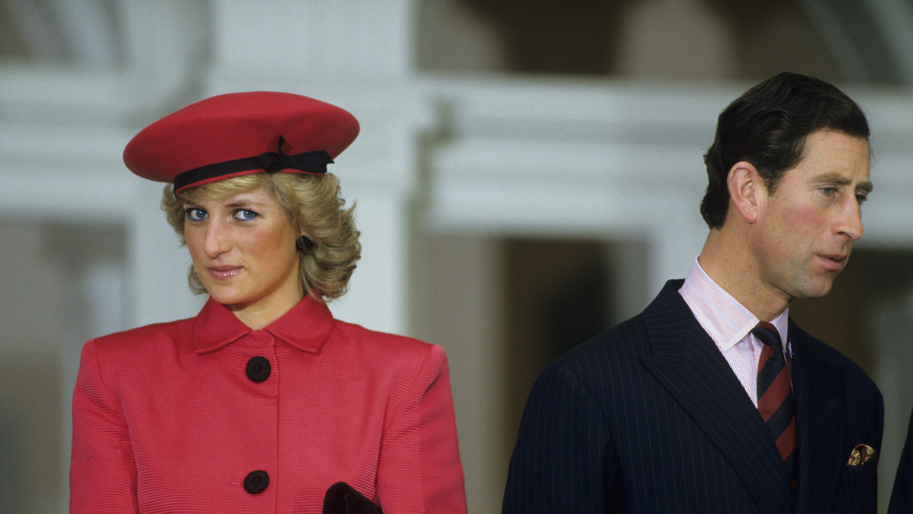 Princess Diana and Prince Charles, looking in different directions