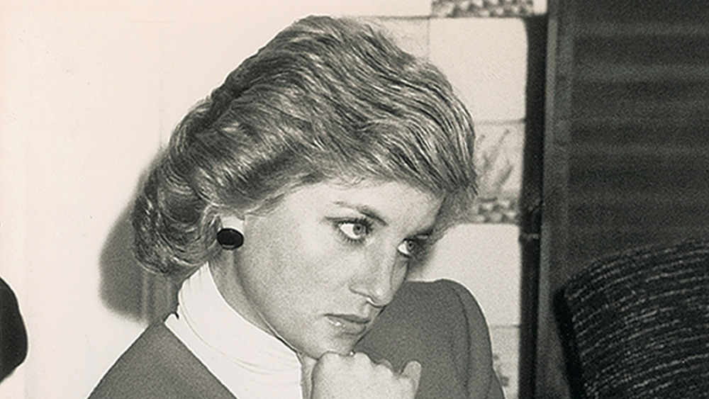 Princess Diana with her hand to her chin