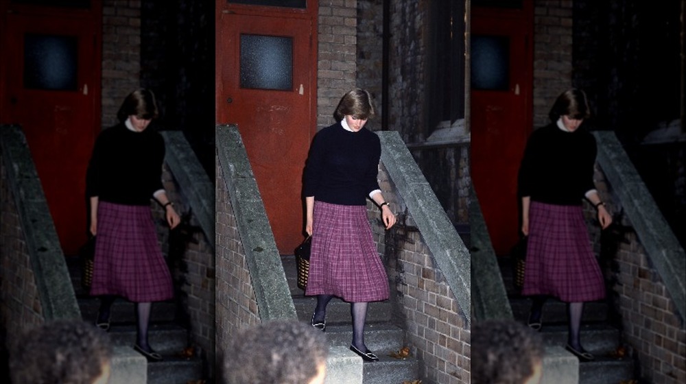 Princess Diana walking down a staircase