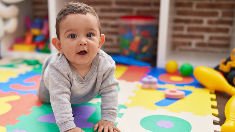 Smiling baby on mat