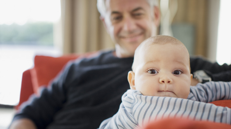 Grandfather sitting with baby