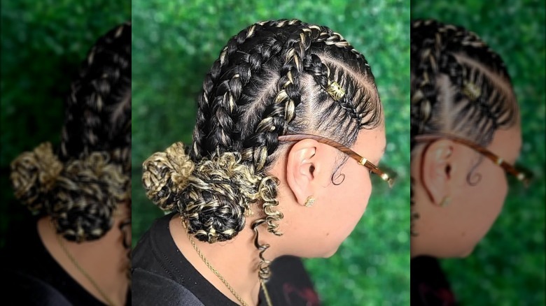 Braids tied into low space buns